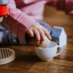 A child playing with coffee cups