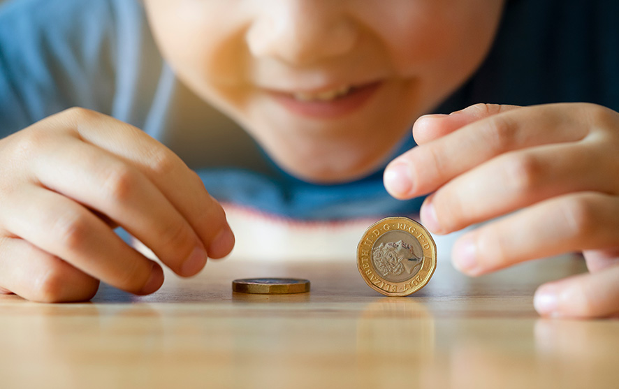 A child playing with coins