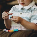 A little boy playing with legos