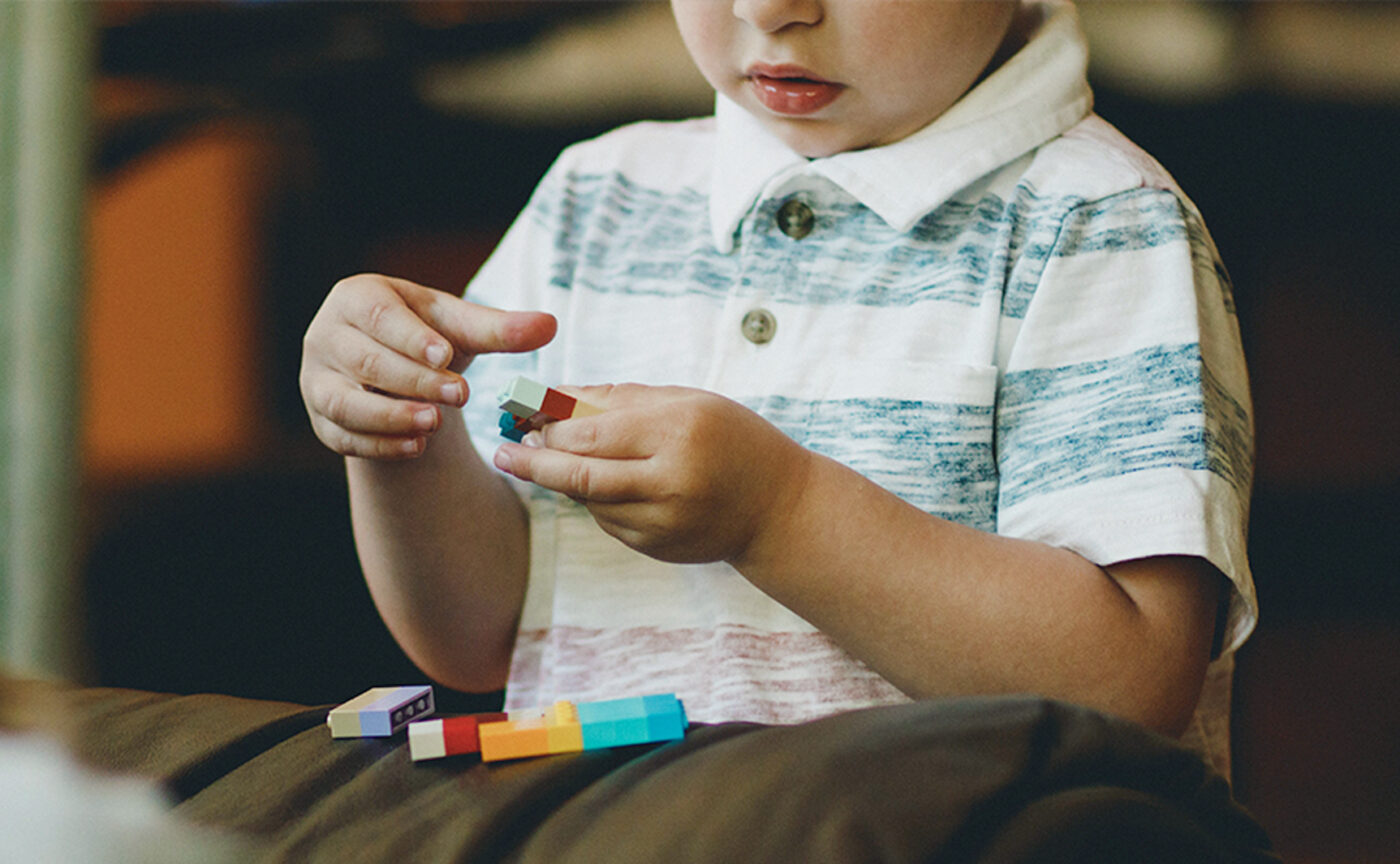 A boy playing with legos