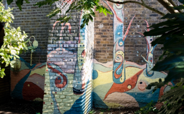 A wall with a colourful mural on it