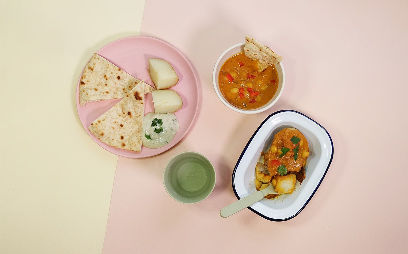 Baked potatoes with chana masala and raita dip