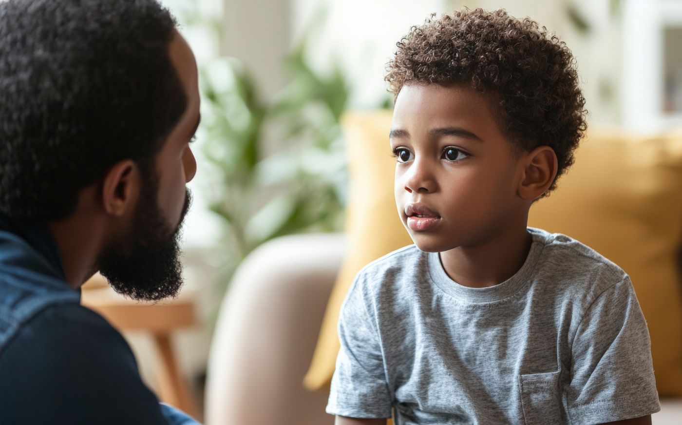 An image of a boy looking at his dad